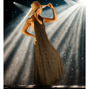 Robe d'été longue dos nu en crêpe de viscose noir et plumetis dorés. Une robe fluide et élégante, intemporelle et unique. Livraison offerte.